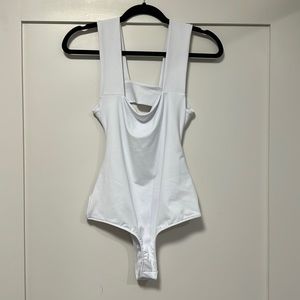 NWT free people strapped back body suit